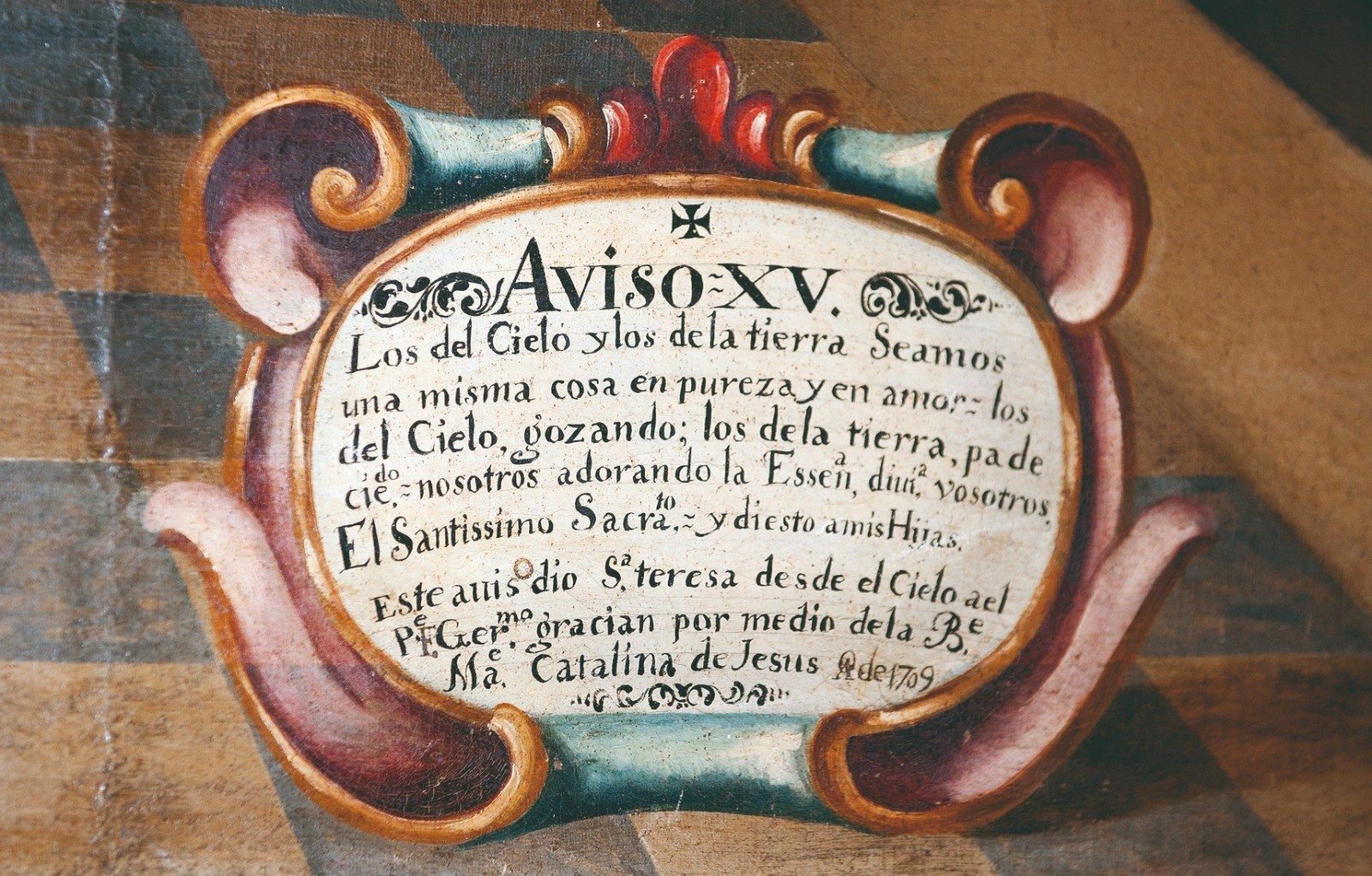 Detalle de la cartela del cuadro con el texto del Aviso XV